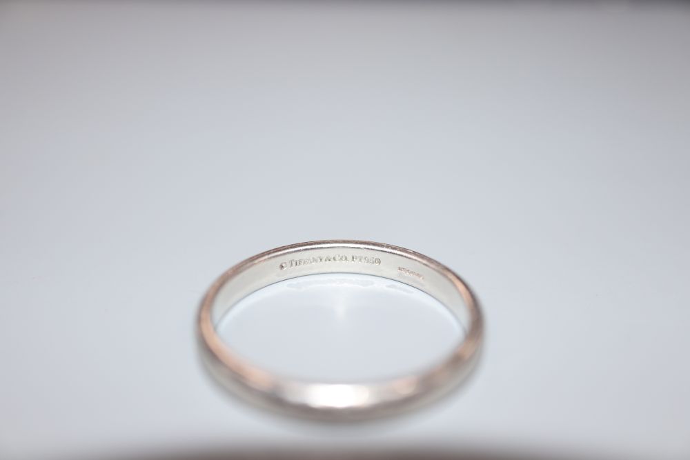A Tiffany & Co platinum wedding band, size R/S, 5.8 grams.
